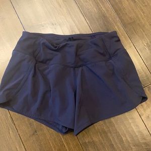navy size 4, 4 inch lululemon speed up shorts
